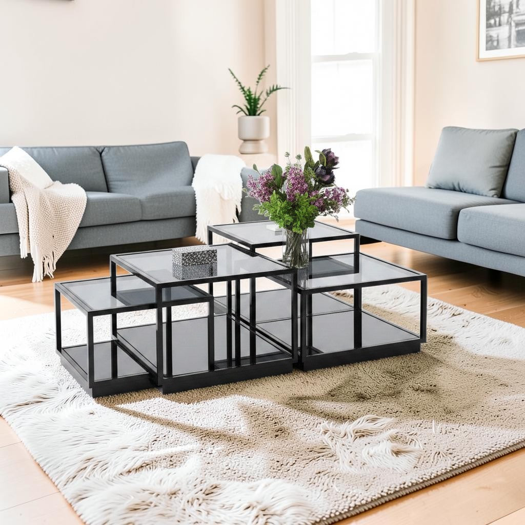 The Nile Luxuries modular coffee table with mirrored surfaces and black frame. Features geometric silhouette and high-gloss finish.