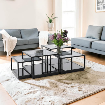 The Nile Luxuries modular coffee table with mirrored surfaces and black frame. Features geometric silhouette and high-gloss finish.