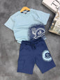 The Nile Luxuries Moncler kids two-piece set with light blue graphic t-shirt and navy cargo shorts with drawstring.