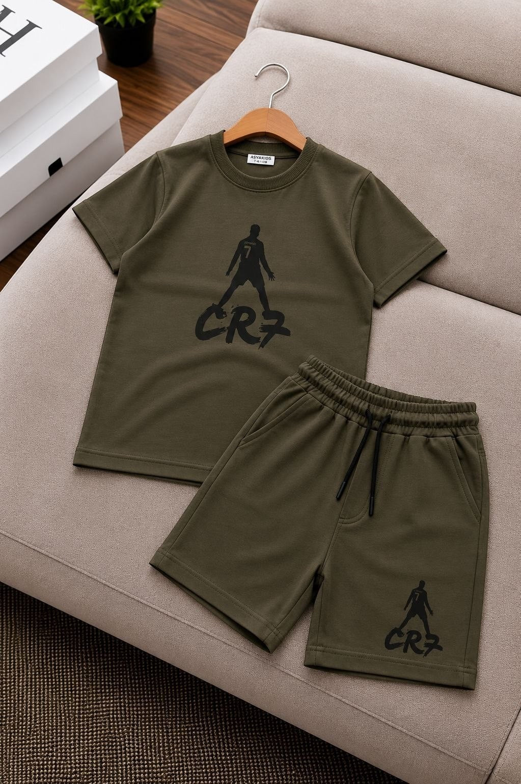 The Nile Luxuries olive green CR7 graphic t-shirt and shorts set for kids with a football-inspired print.