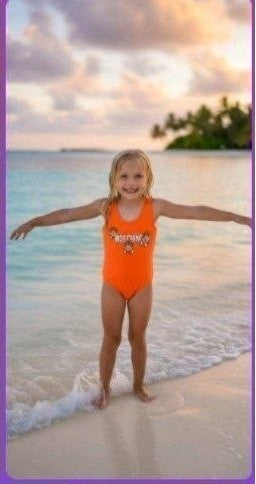 The Nile Luxuries orange graphic one-piece swimsuit for girls, perfect for beach or pool.