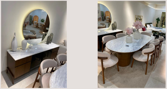 The Nile Luxuries oval marble dining table with dark wood base and upholstered chairs, seats 8. Buffet with marble top and dark wood drawers.