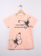 The Nile Luxuries peach cotton blend t-shirt with rhinestone butterfly graphic and text.
