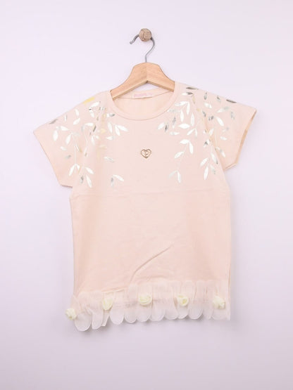 The Nile Luxuries peach cotton t-shirt with metallic leaf print, gold heart emblem, and ruffled hem with fabric roses.