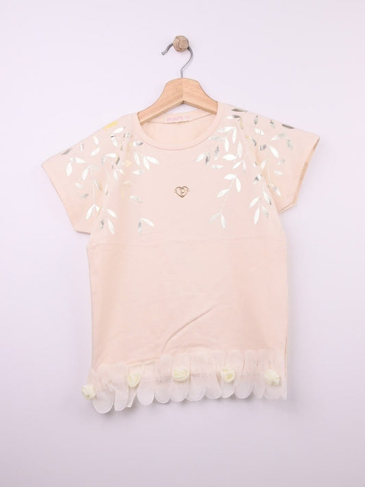 The Nile Luxuries peach cotton t-shirt with metallic leaf print, gold heart emblem, and ruffled hem with fabric roses.