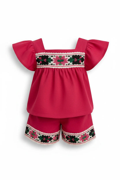 The Nile Luxuries toddler girl hot pink flutter-sleeve top and shorts set with folk-inspired floral embroidery.