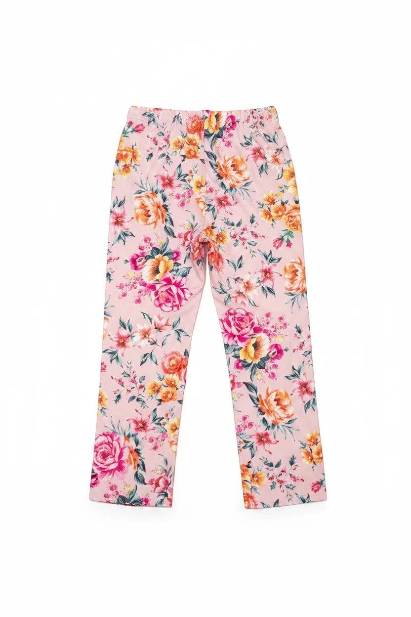 The Nile Luxuries girls pink wide-leg lounge pants featuring a vibrant floral print pattern on a soft fabric.