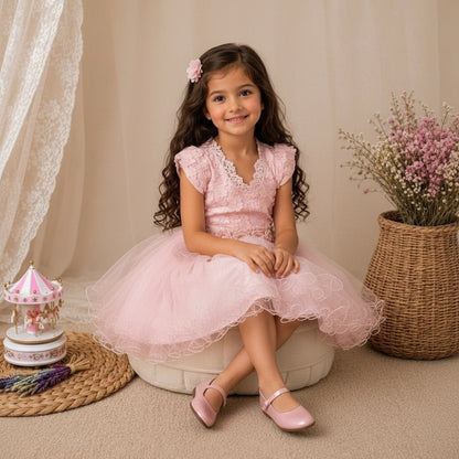 The Nile Luxuries blush pink lace and tulle special occasion dress with floral appliques and cap sleeves.