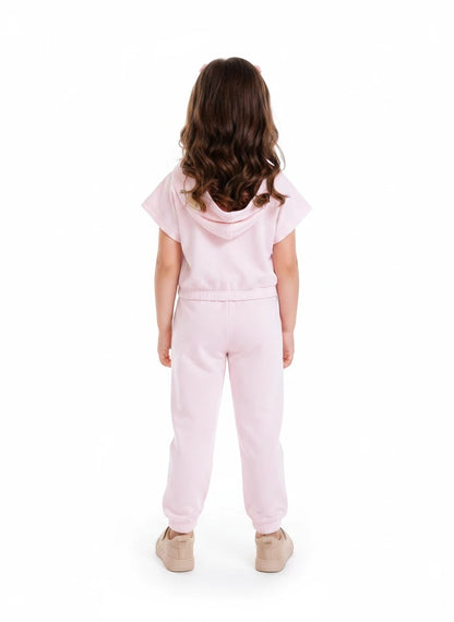 The Nile Luxuries girls light pink short sleeve hoodie and jogger lounge set, back view on a young girl.
