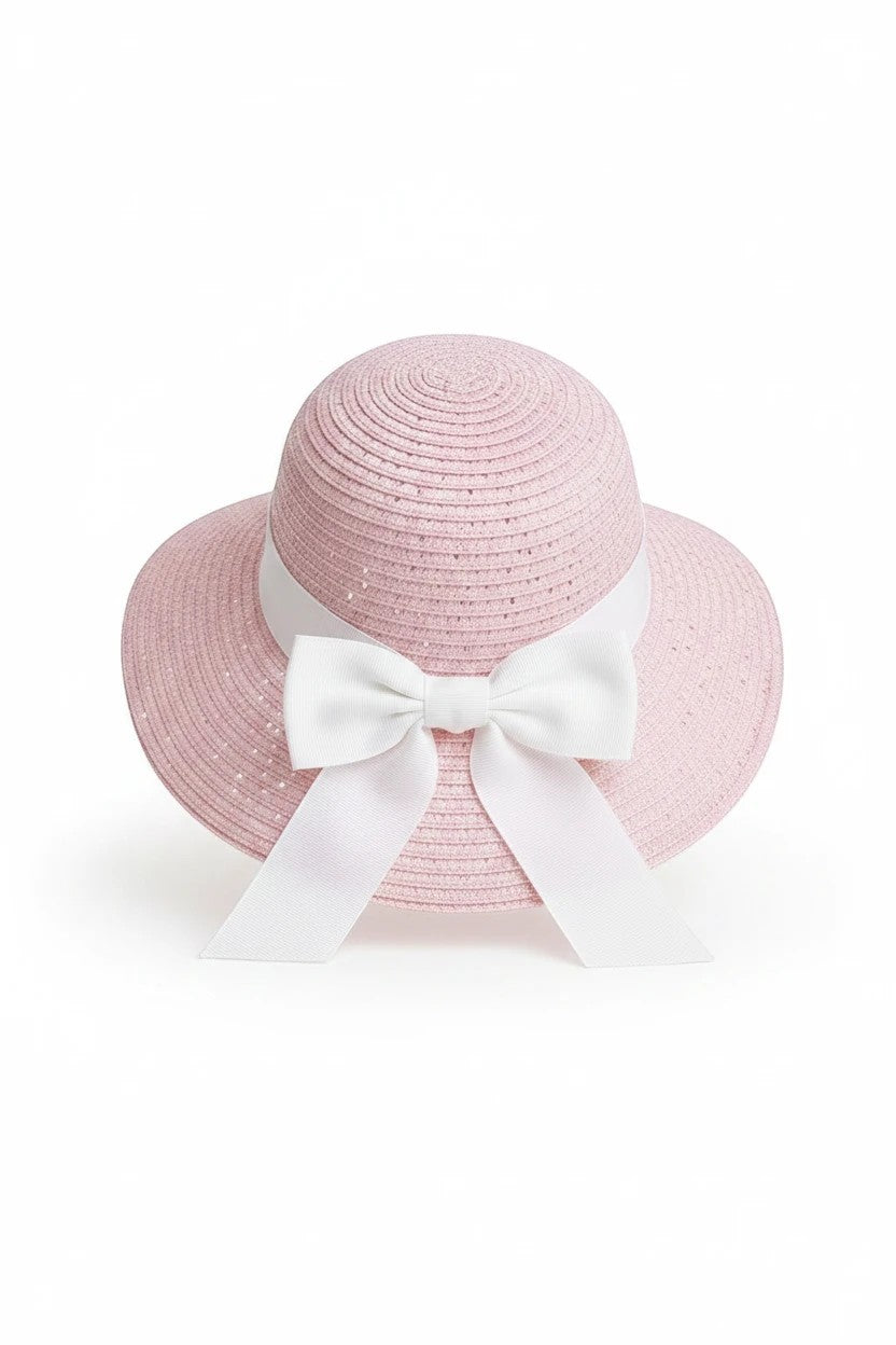 The Nile Luxuries pink woven toddler sun hat with a white ribbon bow, perfect for summer sun protection.