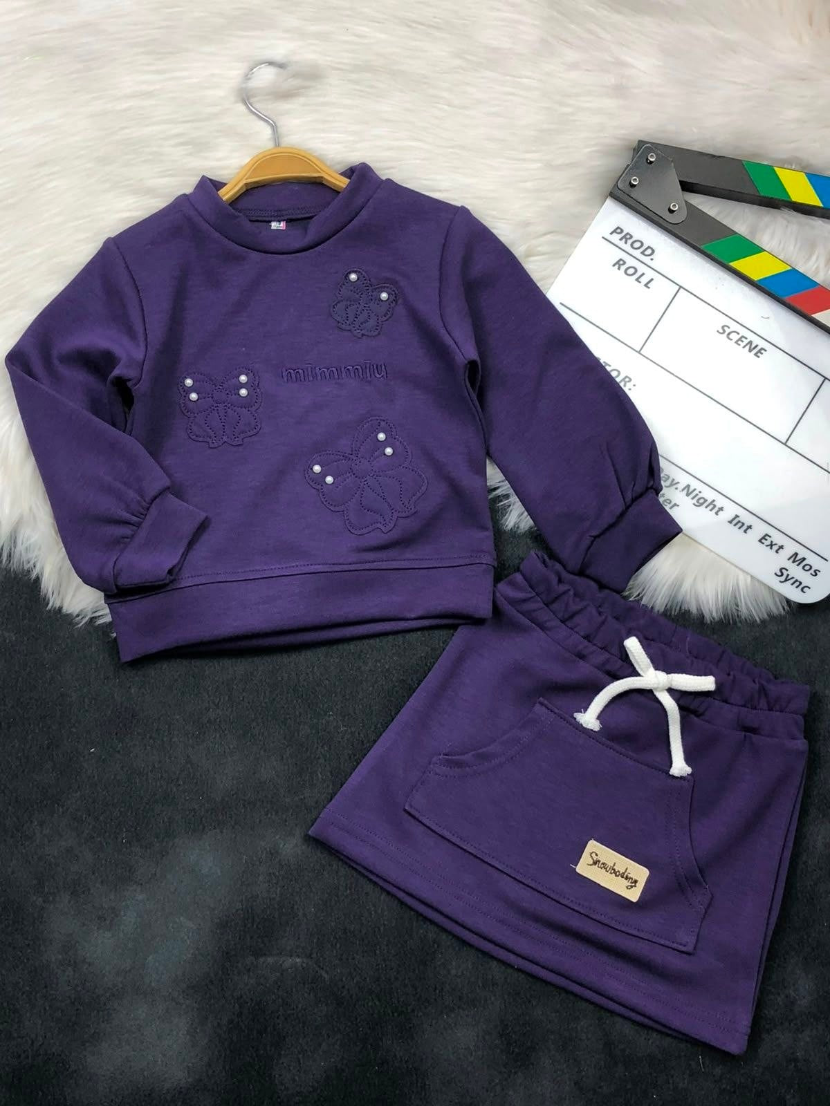 The Nile Luxuries girls purple long sleeve sweatshirt with butterfly embroidery and matching skirt with front pocket