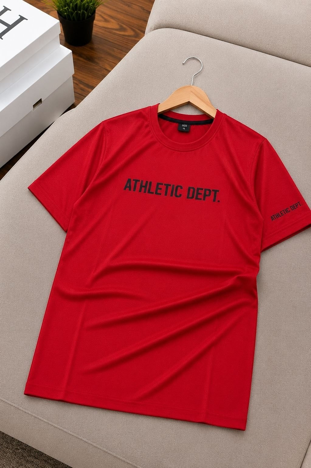 The Nile Luxuries red athletic department short sleeve t-shirt with crew neck and graphic print.