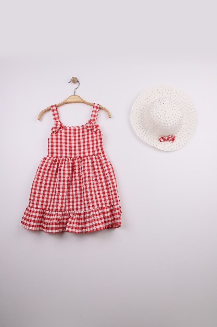 The Nile Luxuries red and white gingham ruffle dress with bow straps and matching hat. Lightweight fabric, perfect for summer.