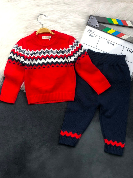 The Nile Luxuries children's red and navy knit sweater and pant set with a festive chevron pattern.