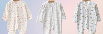 The Nile Luxuries ribbed knit baby sleepsuit with footies, available in cherry, elephant, and bear prints.