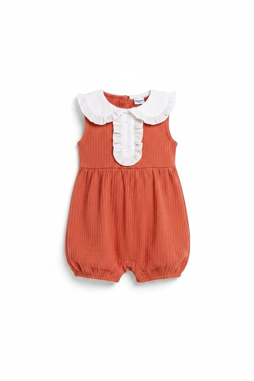 The Nile Luxuries ribbed infant bubble romper in rust with a white ruffled Peter Pan collar and button-down front.