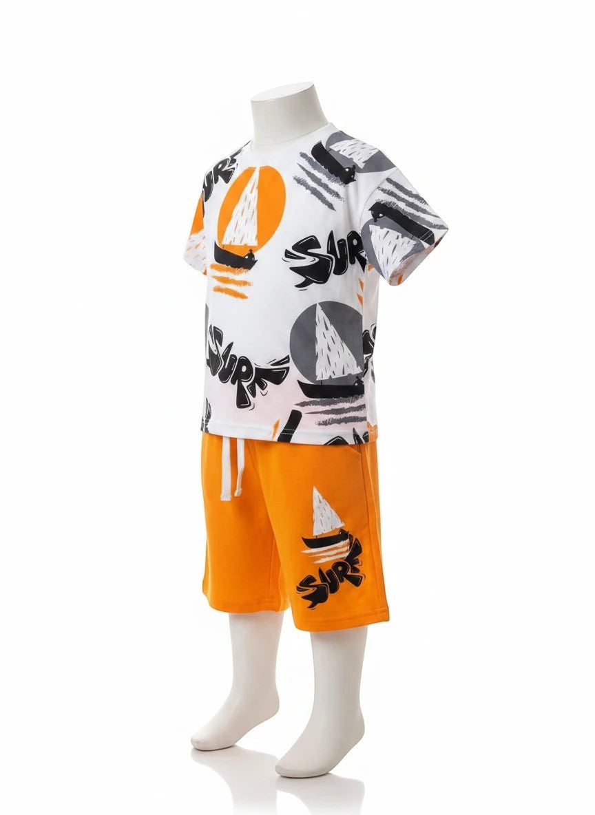 The Nile Luxuries white cotton t-shirt and orange shorts set with sailboat and "SURF" graphic print.
