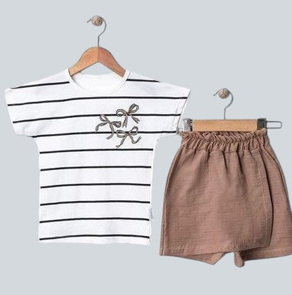 The Nile Luxuries black and white striped t-shirt with embroidered bows and brown shorts set.