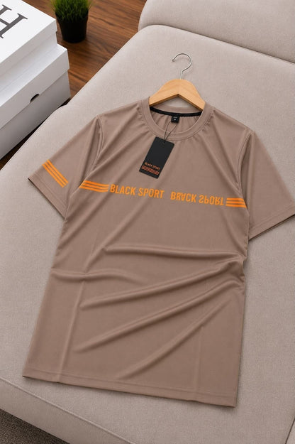 The Nile Luxuries tan performance crew neck t-shirt with orange chest graphic and sleeve stripes on a hanger