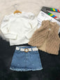 The Nile Luxuries three-piece set with a white ribbed puff-sleeve top, beige faux-fur vest, and heart-embroidered skirt.