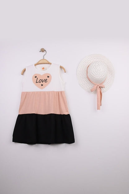 The Nile Luxuries sleeveless tiered dress in white, peach, and black with a heart graphic that says "Love".