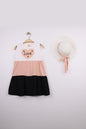 The Nile Luxuries sleeveless tiered dress in white, peach, and black with a heart graphic that says "Love".