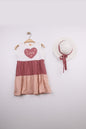 The Nile Luxuries tiered sleeveless dress in white, rose, and blush pink with a heart graphic that says "Love".