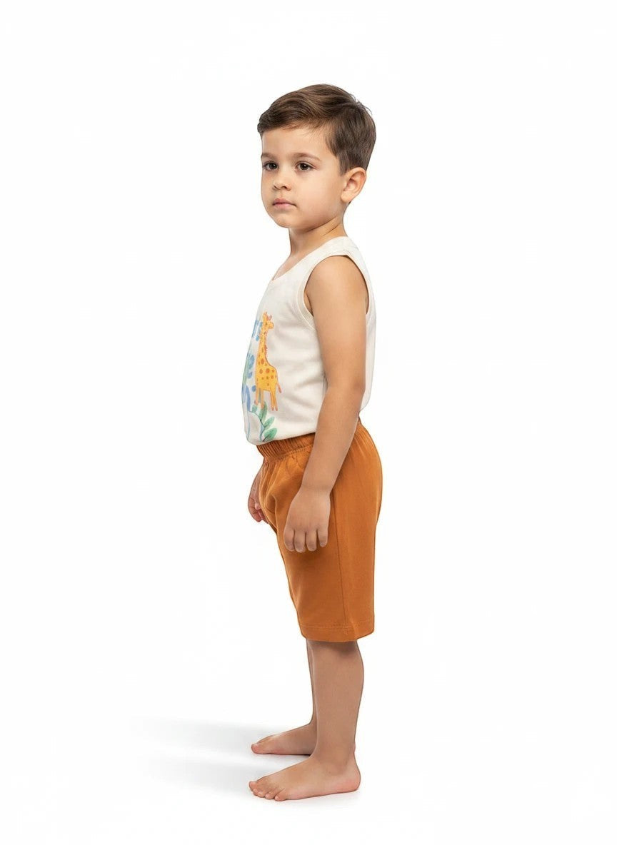 The Nile Luxuries toddler outfit with a cream animal graphic tank top and rust-colored shorts on a young boy