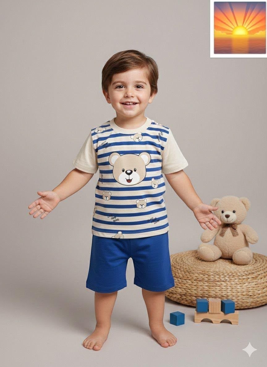 Toddler boy wearing The Nile Luxuries bear print striped t-shirt and blue shorts set with a teddy bear toy nearby.