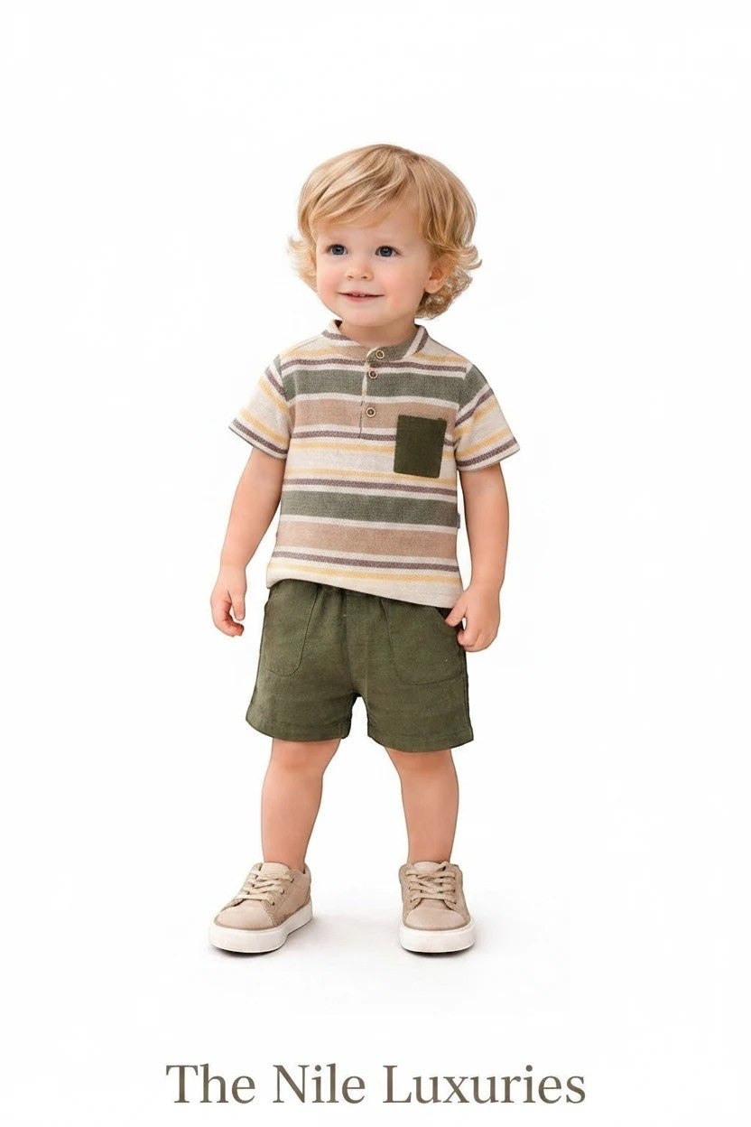 Toddler boy wearing The Nile Luxuries striped henley shirt and olive green shorts set against a white background.