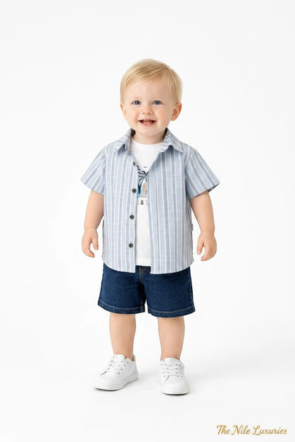 Toddler boy wearing The Nile Luxuries summer outfit: striped button-down, Palms Beach graphic tee, and denim shorts.