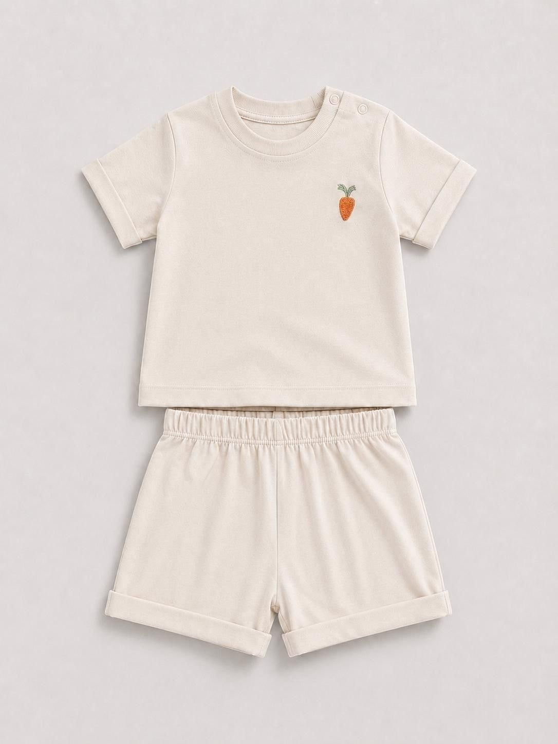 The Nile Luxuries toddler beige short sleeve shirt and shorts set with a cute embroidered carrot on the chest.
