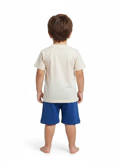 The Nile Luxuries toddler set with a plain cream short-sleeve t-shirt and solid blue shorts, back view.