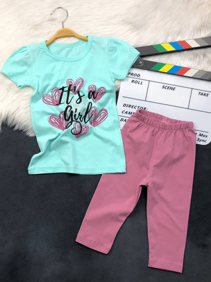 The Nile Luxuries toddler girl outfit set with a mint green graphic t-shirt and dusty pink leggings.