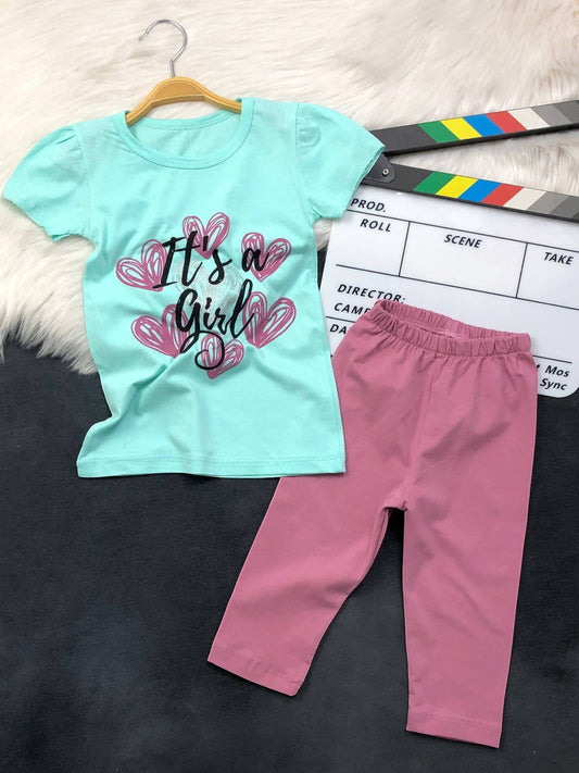 The Nile Luxuries toddler girl outfit set with a mint green graphic t-shirt and dusty pink leggings.