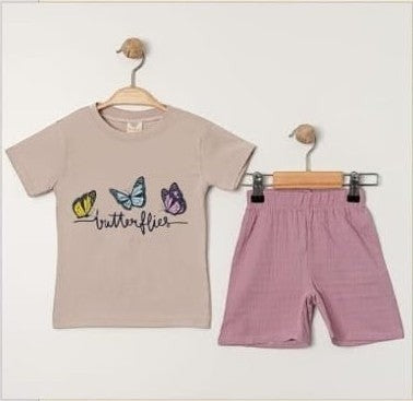 The Nile Luxuries toddler girls beige cotton t-shirt with butterfly graphic and pink shorts set. Short sleeves, crew neck.