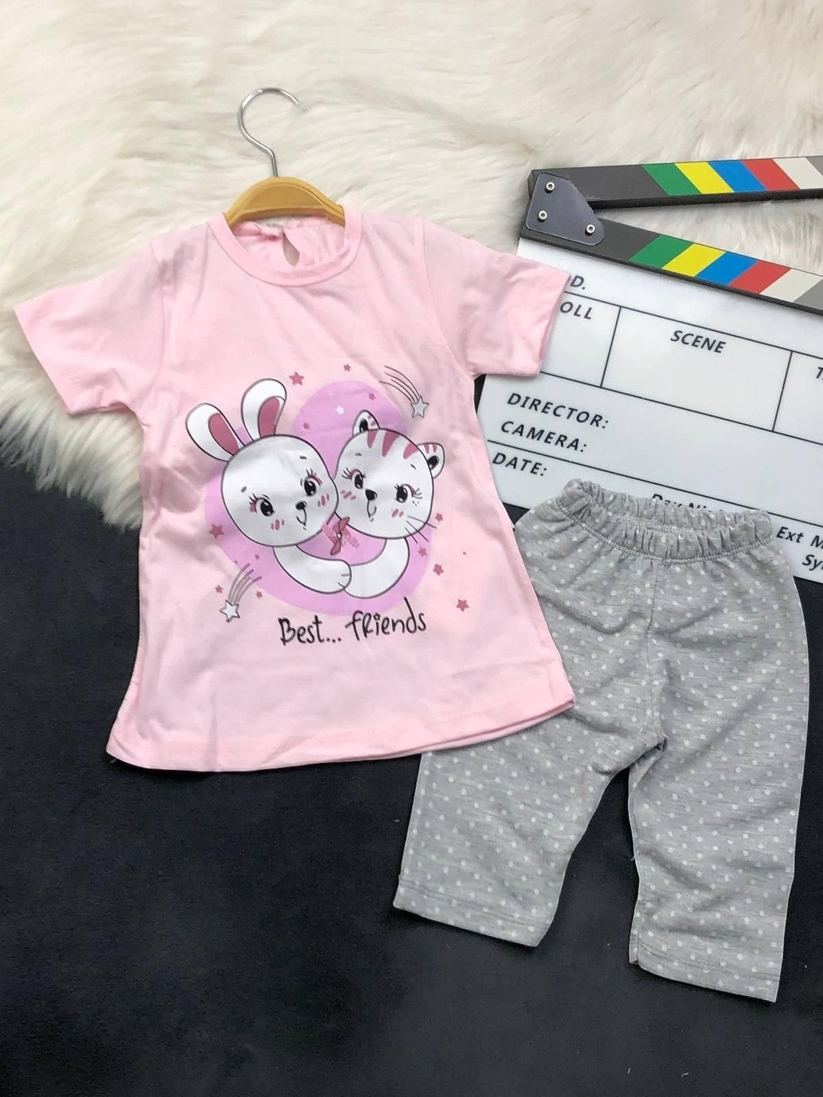 The Nile Luxuries toddler lounge set with a pink Best Friends graphic t-shirt and grey polka-dot cropped leggings.
