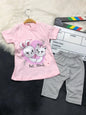 The Nile Luxuries toddler lounge set with a pink Best Friends graphic t-shirt and grey polka-dot cropped leggings.