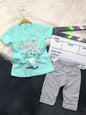 The Nile Luxuries toddler outfit with mint green Lovely Day graphic t-shirt and grey polka dot leggings.