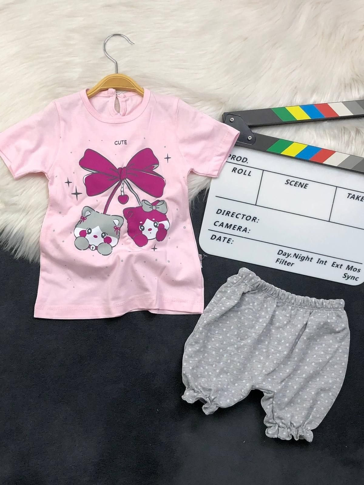 The Nile Luxuries toddler set with a pink kitten graphic t-shirt and grey polka-dot ruffled bloomers.