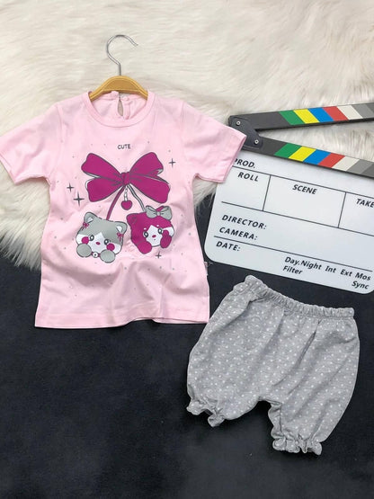 The Nile Luxuries toddler set with a pink kitten graphic t-shirt and grey polka-dot ruffled bloomers.