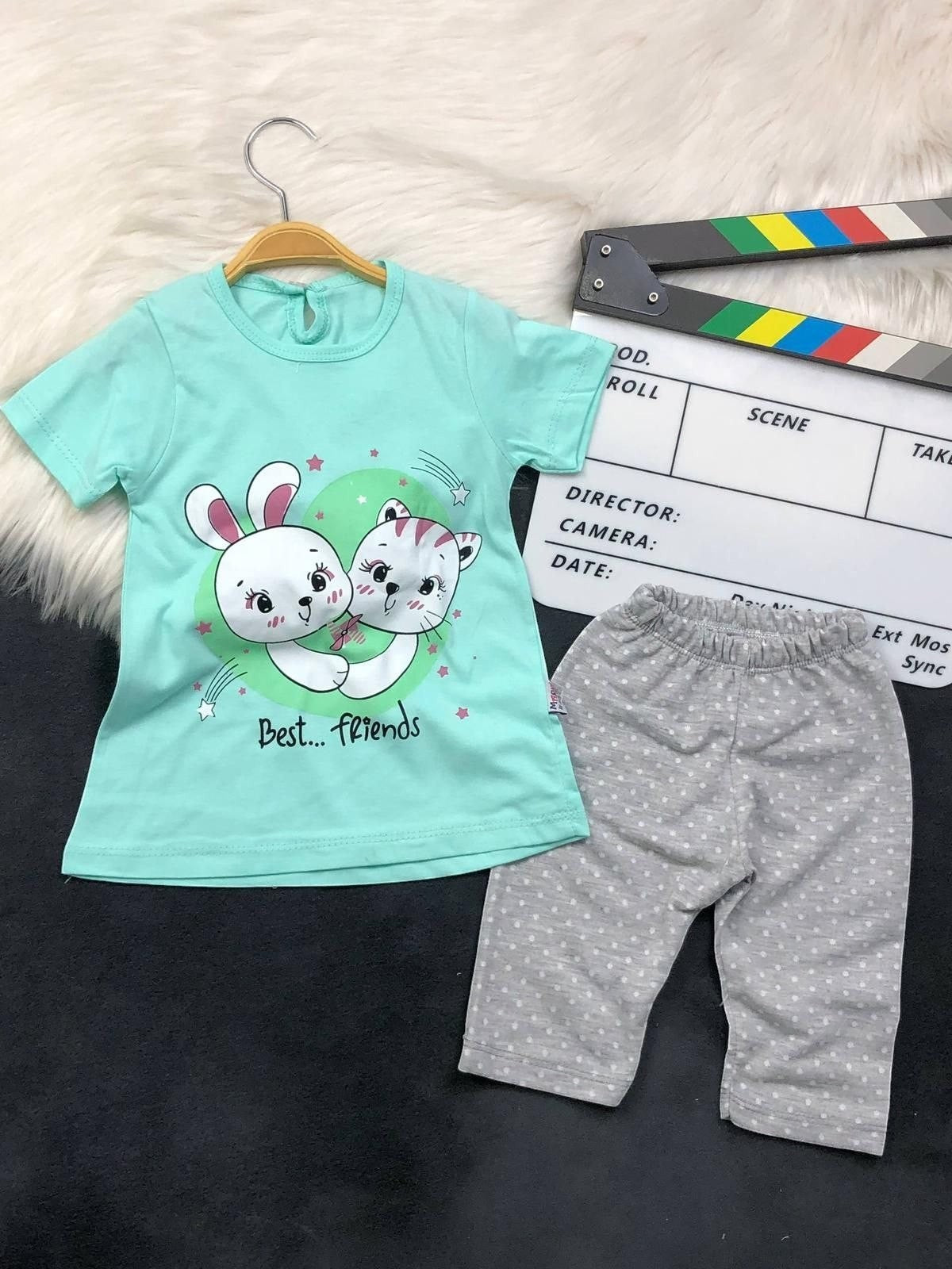 The Nile Luxuries toddler lounge set with a mint green Best Friends bunny and kitten t-shirt and grey polka-dot leggings.