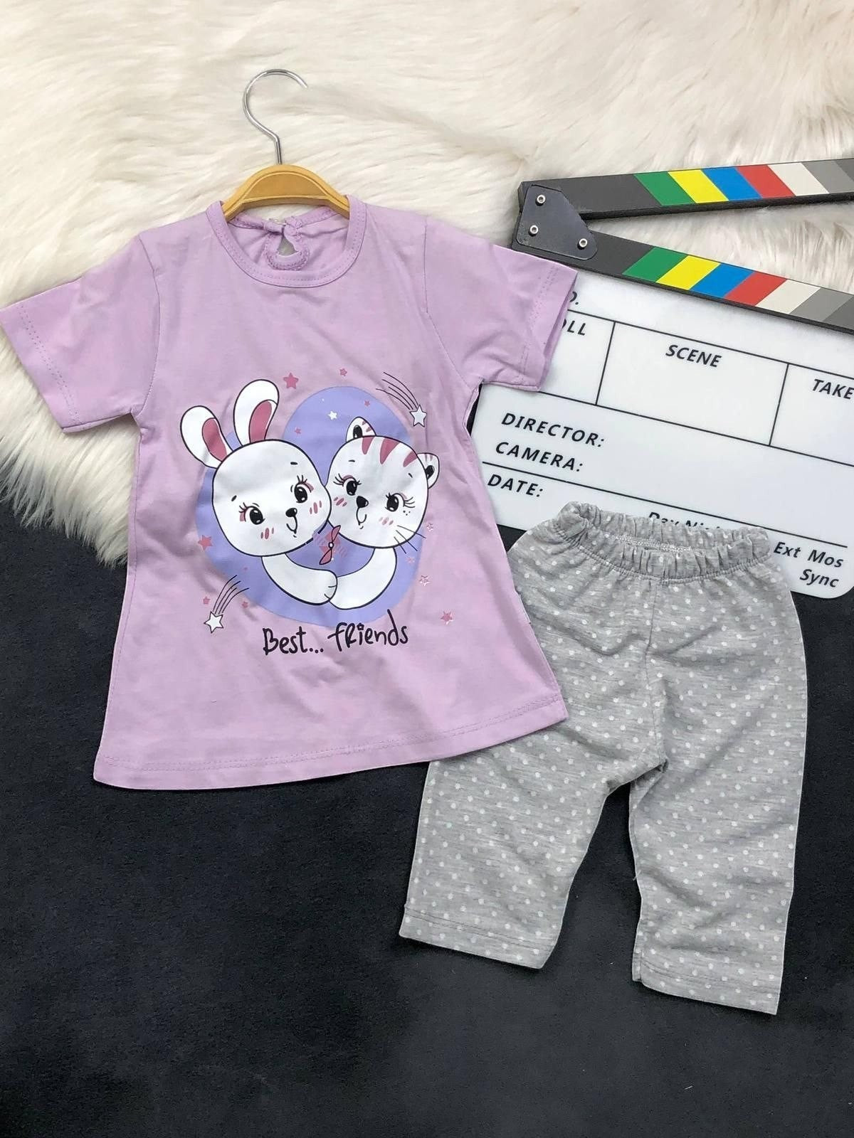 The Nile Luxuries toddler lounge set with a purple Best Friends graphic t-shirt and grey polka-dot cropped leggings.