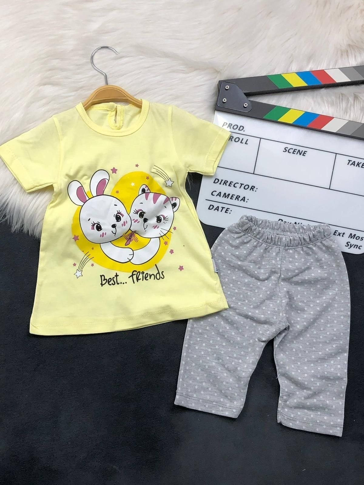 The Nile Luxuries toddler lounge set with a yellow Best Friends bunny and kitten graphic tee and grey polka-dot leggings.