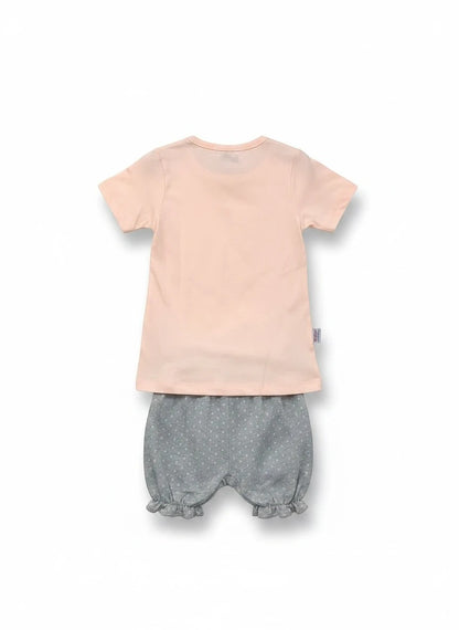 The Nile Luxuries toddler set with a plain peach t-shirt and grey polka-dot ruffled bloomers, back view.