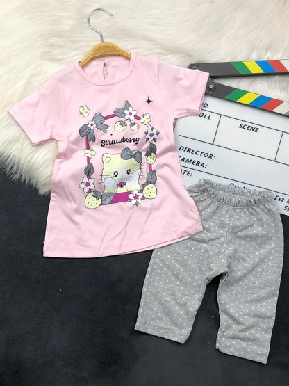 The Nile Luxuries toddler pajama set with a pink kitten graphic t-shirt and grey polka dot pants.