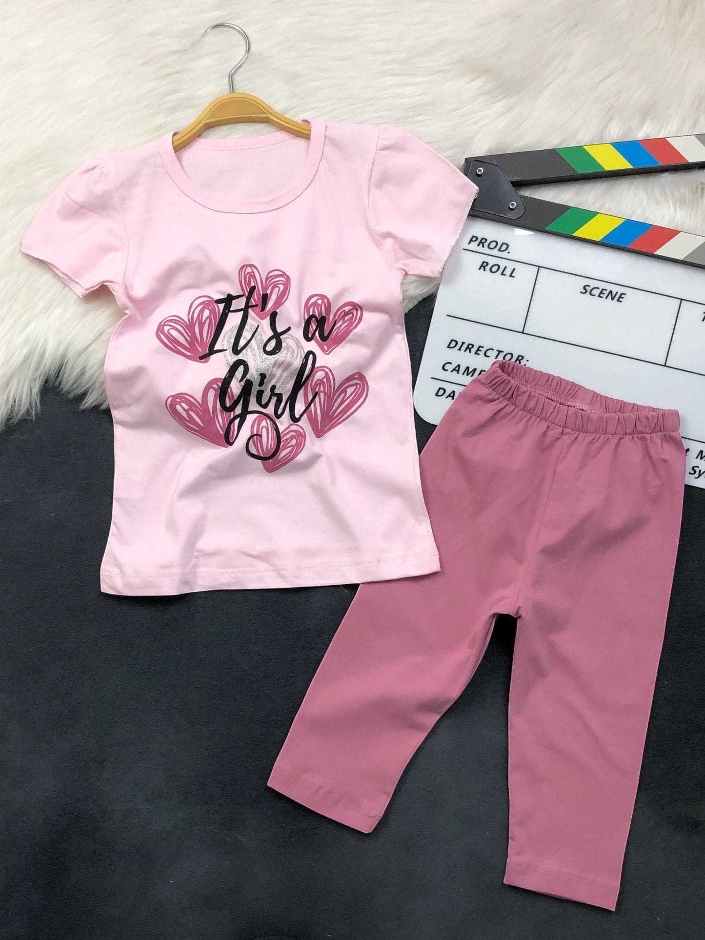 The Nile Luxuries toddler girl outfit featuring a light pink graphic t-shirt and darker pink stretchy leggings.