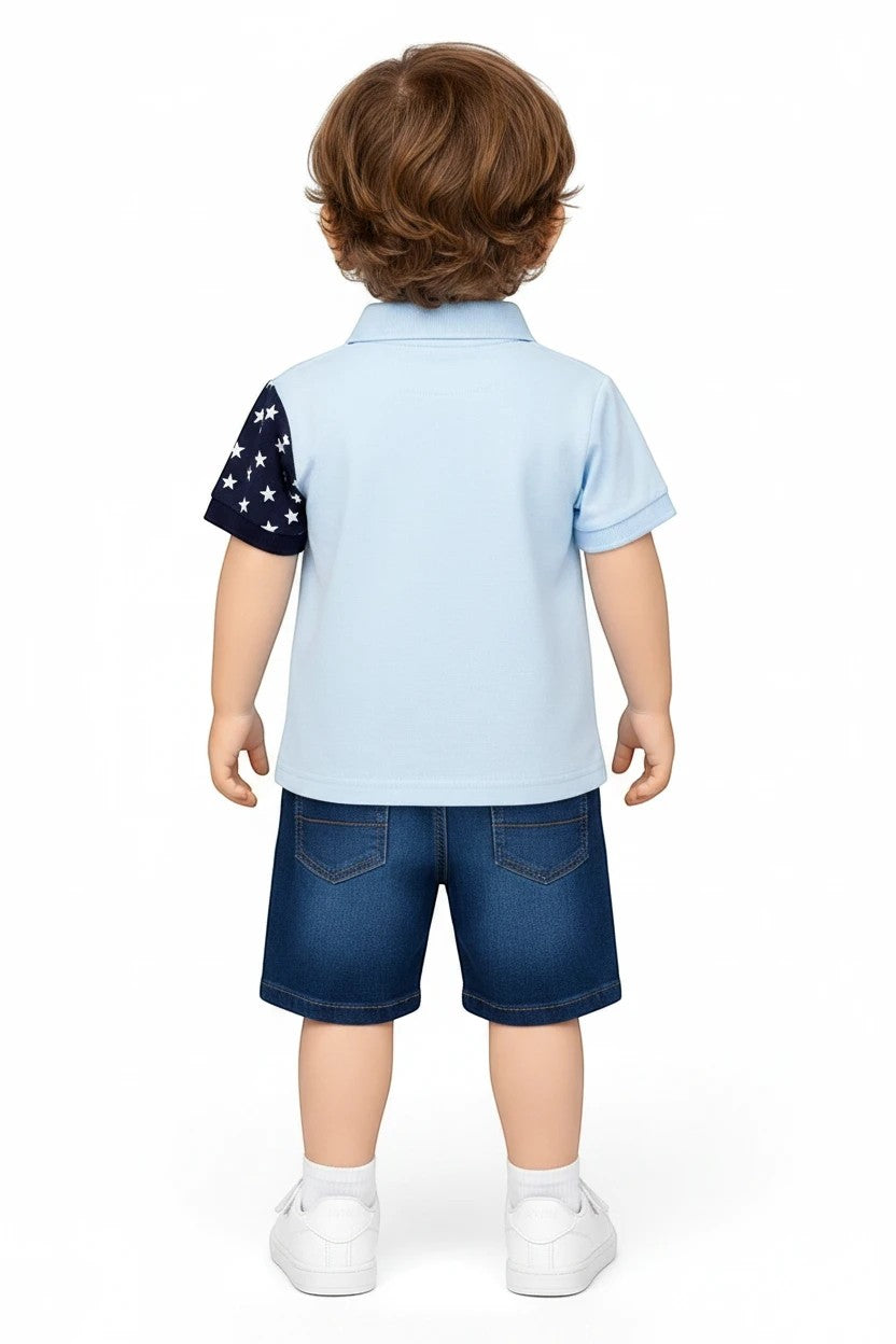 Toddler boy wearing The Nile Luxuries light blue polo with star-print sleeve and denim shorts from behind.