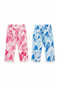 The Nile Luxuries girls' wide-leg trousers in pink and blue with artistic tropical leaf patterns and back pockets.