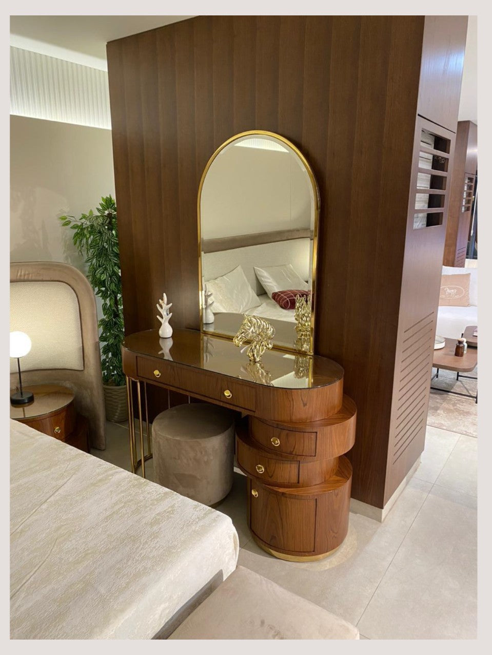 The Nile Luxuries contemporary walnut wood dressing table with gold accents and arched mirror. Includes a plush stool.